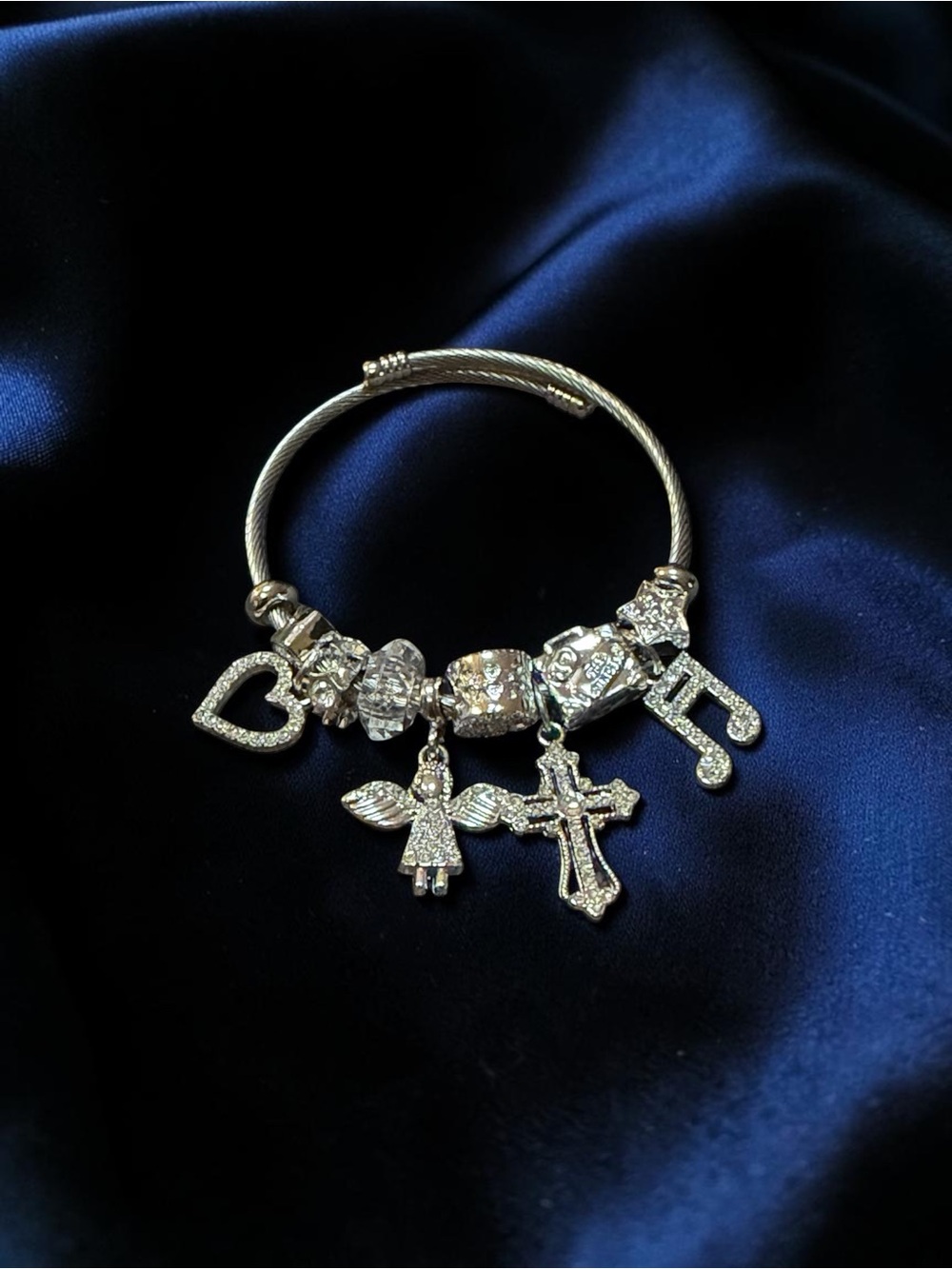 Silver Charm twisted Bangle with Angel & Cross Charms